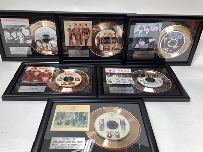 Lot 2638 - Group of framed gold plated Beatles CDs