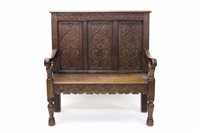 Lot 1647 - 19th century carved oak settle with triple...