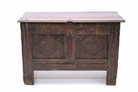 Lot 1648 - Small-size carved oak coffer with hinged plank...