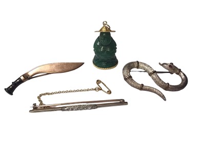 Lot 64 - Antique yellow and white gold diamond set bar brooch, 9ct gold kukri brooch, white metal snake brooch and a Chinese carved green hard stone/ jade figure with 14ct gold pendant mounts