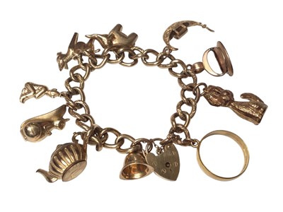 Lot 85 - 9ct gold curb link charm bracelet with padlock clasp and ten gold charms to include eight 9ct gold, yellow metal seal and 22ct gold ring