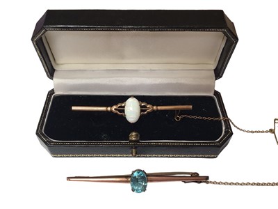 Lot 87 - 9ct rose gold blue zircon bar brooch and 9ct gold opal bar brooch (2)