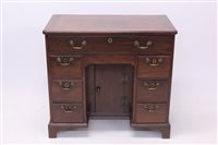 Lot 1652 - Good George II mahogany kneehole desk - the...