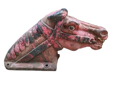 Lot 2541 - Very heavy antique metal merry-go-round / fairground horse's head with remains of paintwork, 53cm long, together with a Jack and Jill sign (2)