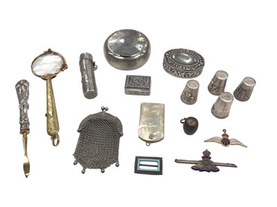 Lot 123 - Group of silver and white metal trinkets including snuff boxes, miniature mesh purse, scent bottle, thimbles, silver and enamel military sweetheart brooch, gilt metal and enamel RAF pendant, pai...