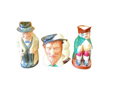 Lot 1176 - Five Royal Doulton character jugs - Veteran Motorist, Jockey, The Genie, Touchstone and Sir Francis Drake, together with two toby jugs Winston Churchill and Old Charlie (7)