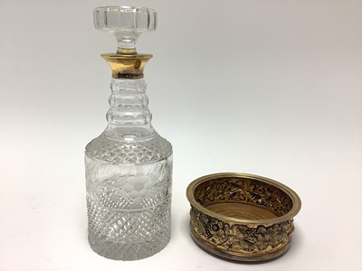 Lot 260 - Silver gilt wine coaster and cut glass decanter with stopper