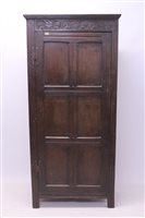 Lot 1662 - Oak standing cupboard with lunette carved...