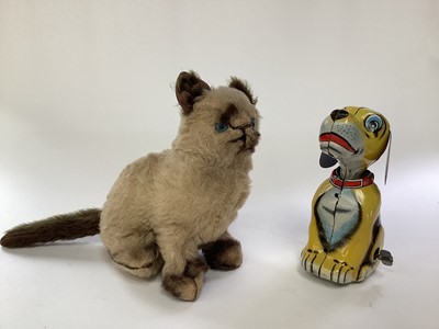 Lot 1952 - Vintage Japanese tinplate clockwork dog and a vintage plush cat (2)