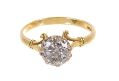 Lot 444 - Diamond single stone ring with a brilliant cut diamond estimated to weigh approximately 1.75cts, in a claw setting with scroll shoulders on18ct gold shank