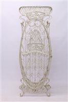 Lot 1668 - French Art Nouveau wirework Wine rack of ovoid...