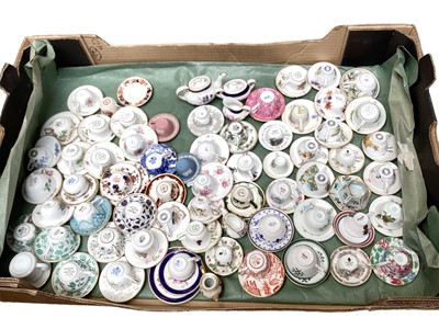 Lot 1199 - Large collection of miniature cups and saucers, various manufacturers including Wedgwood, Coalport, Spode, Mason's etc - 2 boxes