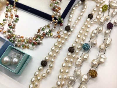 Lot 1029 - Cultured pearl multi coloured triple strand necklace, two other cultured pearl necklaces, mother of pearl bead necklace and three pairs of pearl earrings