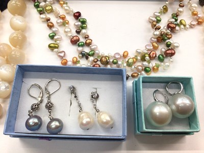 Lot 1029 - Cultured pearl multi coloured triple strand necklace, two other cultured pearl necklaces, mother of pearl bead necklace and three pairs of pearl earrings