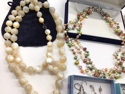 Lot 1029 - Cultured pearl multi coloured triple strand necklace, two other cultured pearl necklaces, mother of pearl bead necklace and three pairs of pearl earrings