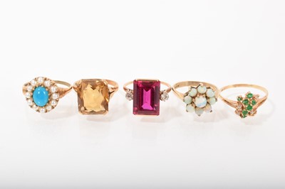 Lot 555 - Five gold and gem set dress rings