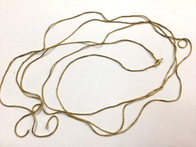 Lot 1033 - Eastern yellow metal long chain with T-bar clasp