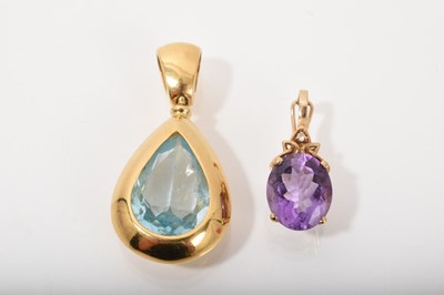 Lot 560 - Blue topaz pear shape pendant in 18ct yellow gold setting and 9ct gold amethyst and diamond pendant