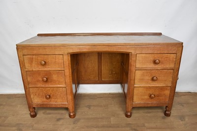 Lot 1206 - Robert ‘Mouseman’ Thompson oak desk and leather desk chair