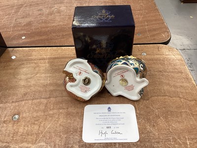 Lot 1208 - Two Royal Crown Derby limited edition paperweights - Dragon of Happiness and Dragon of Good Fortune, no. 665 of 1500, 1 box and 1 certificate