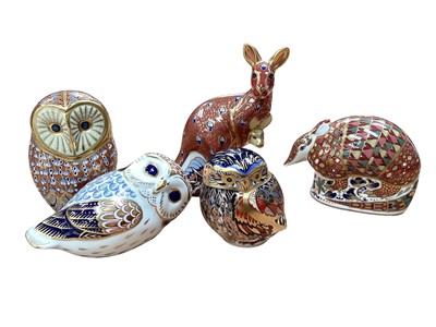 Lot 1214 - Five Royal Crown Derby paperweights to include Kangaroo, Armadillo and Owls