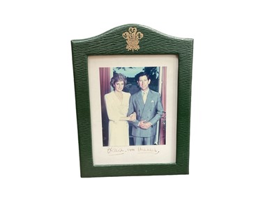 Lot 1 - T.R.H. The Prince and Princess Wales, fine 1988 signed presentation colour portrait photograph of the Royal couple signed in ink on the mount 'Charles 1988 Diana', in original green Morocco lea...