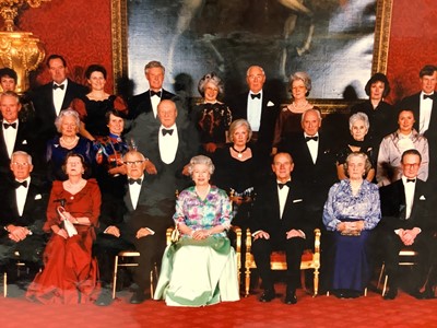 Lot 3 - H.M. Queen Elizabeth II and H.R.H. The Duke of Edinburgh, signed presentation colour photograph of the Royal couple with guests following a Royal dinner including Air Vice Marshal Sir John Severn...