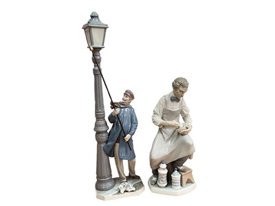 Lot 1226 - Four Lladro porcelain figures including lamp lighter and doctor