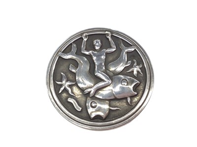 Lot 186 - Georg Jensen silver circular plaque brooch depicting a merman, fish and star fish, no. 285