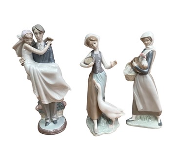 Lot 1229 - Six Lladro porcelain figures including married couple, girl with doll and lady sat on a tree stump