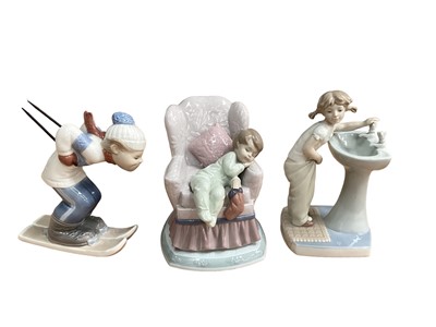 Lot 1232 - Six Lladro porcelain figures including Skier and girl at the sink