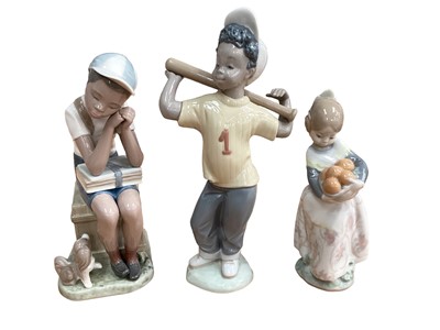 Lot 1233 - Six Lladro and Nao porcelain figures including Spanish Orange seller and Boy with baseball bat