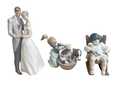 Lot 1234 - Six Lladro porcelain figures including married couple and girl washing a dog