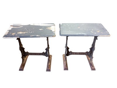 Lot 1318 - Pair of Victorian cast iron table bases, the decorative end standards with scroll and pierced decoration joined by a stretcher, with later wooden tops