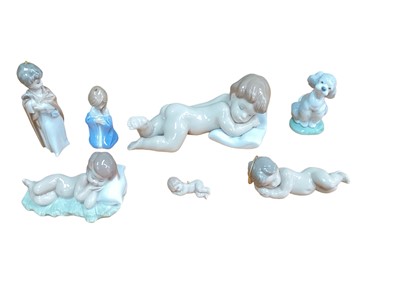 Lot 1249 - Seven small Lladro porcelain figures including sleeping babies and a dog