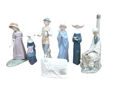 Lot 1252 - Six Lladro porcelain figures including nuns, together with a plaque (7)