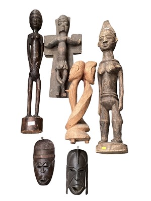 Lot 2559 - Four large African carved wood figures and two masks