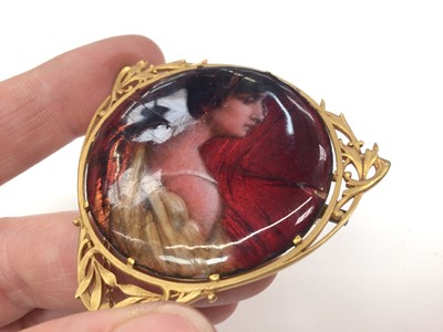 Lot 198 - Jean Baptiste Issanchou (1875 – 1960) Limoges circular enamel plaque depicting a classical maiden, 40mm diameter, in a French 18ct gold pendant/ brooch mount on gold chain, signed verso