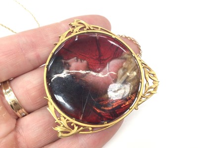 Lot 198 - Jean Baptiste Issanchou (1875 – 1960) Limoges circular enamel plaque depicting a classical maiden, 40mm diameter, in a French 18ct gold pendant/ brooch mount on gold chain, signed verso