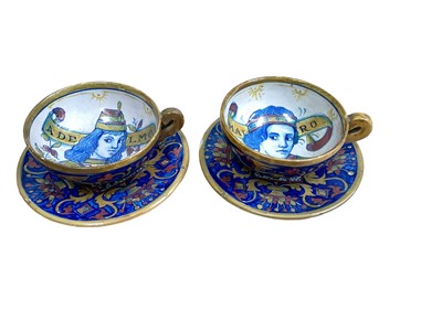 Lot 1262 - A pair of Italian majolica cups and saucers, decorated in the Renaissance style with named portraits, marked 'Gualdo'