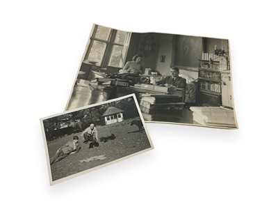 Lot 720 - Two Second World War era photographs- Barnes Wallis crouching with puppies, inscribed in pencil on reverse, 11.4 x 7.7cm, together with another of Sir Frank Whittle, inscribed in pen on reverse,...