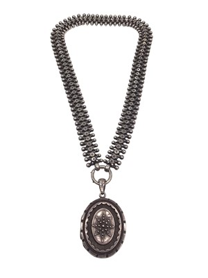 Lot 208 - Victorian silver oval locket pendant on a fancy link chain