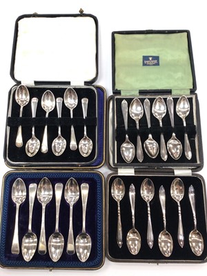 Lot 210 - Four sets of six silver teaspoons in fitted cases