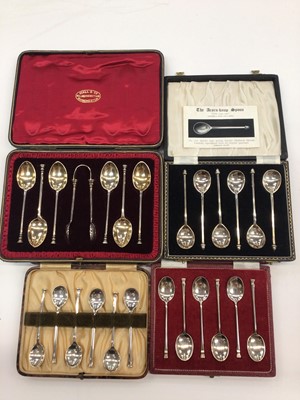 Lot 211 - Four sets of six silver seal end and acorn knop tea/coffee spoons in fitted cases