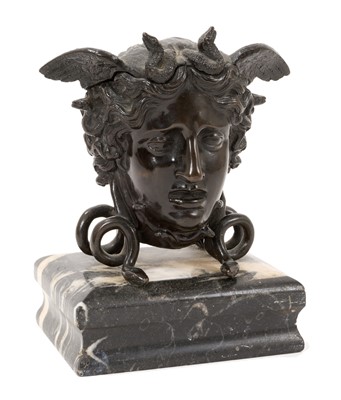 Lot 812 - Bronze Medusa head inkwell, with hinged cover, on snake supports and marble base, 15cm high