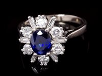 Lot 673 - Sapphire and diamond cluster ring, the...