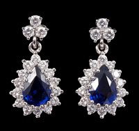 Lot 674 - Pair sapphire and diamond cluster pendant...