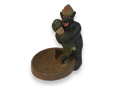 Lot 742 - Unusual painted plaster model of Hitler being 'bear-hugged' by a Russian bear, purportedly won in a fishing competition in France in the late 1940s