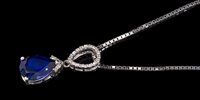 Lot 675 - Diamond and synthetic sapphire pendant with a...