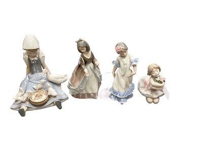 Lot 1276 - Eight Lladro porcelain figures including girl feeding ducks and girls with flowers and birds